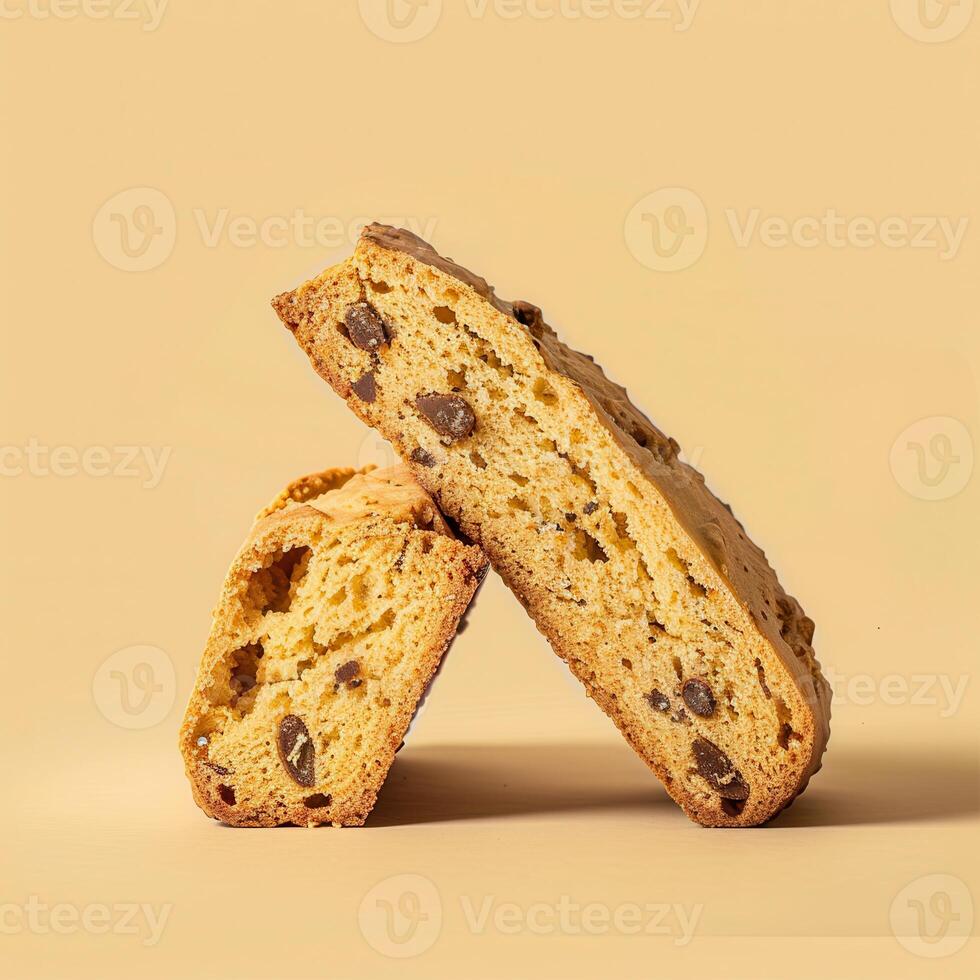 Close-up of two delicious chocolate chip biscotti on a beige background. Italian biscotti cookies perfect for coffee, tea, or... 