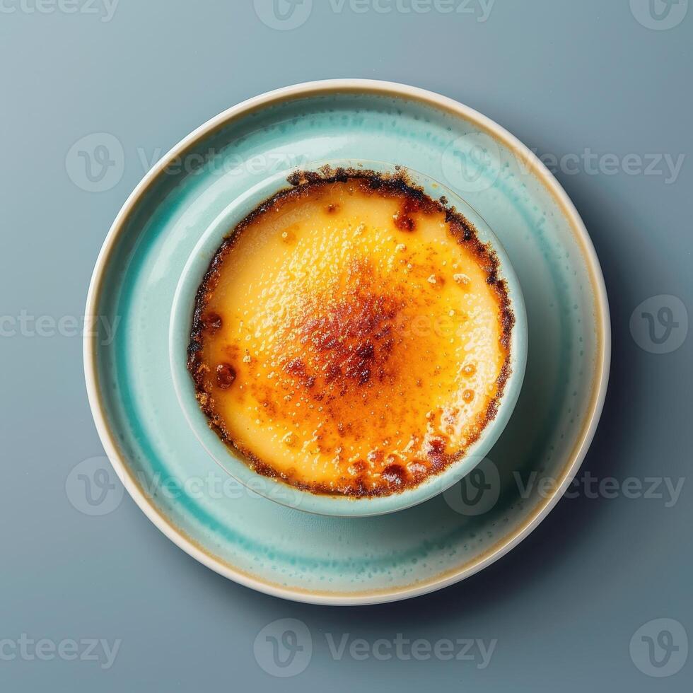 Close-up of a delicious creme brulee dessert with a crispy caramelized sugar topping. Creamy and sweet treat perfect for a romantic dinner or special occasion. photo