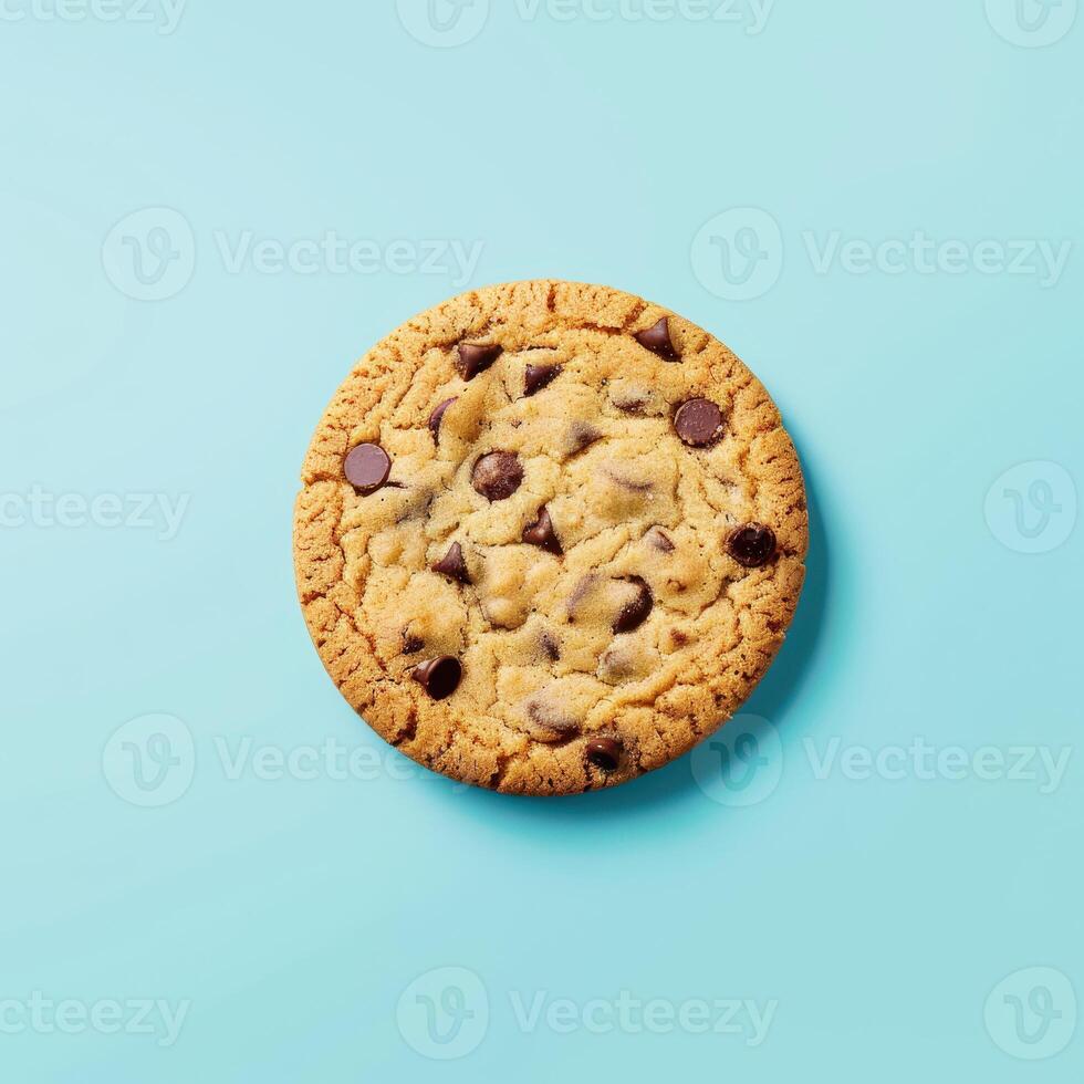 Close up of chocolate chip cookie on blue background. Top view. Concept of dessert, baking, sweet, treat, delicious, snack, food photography. photo