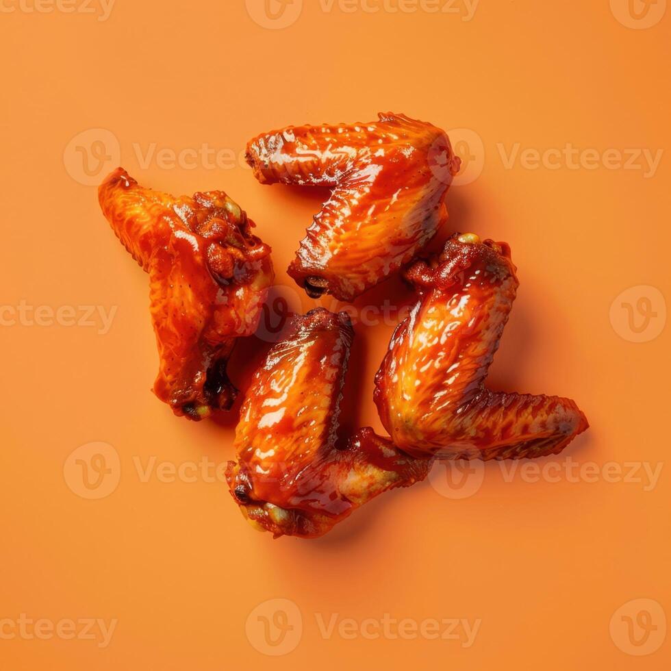 Chicken Wings on Orange Background photo