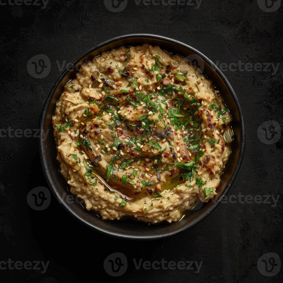 A Bowl of Creamy Baba Ganoush, Traditional Middle Eastern Dip photo