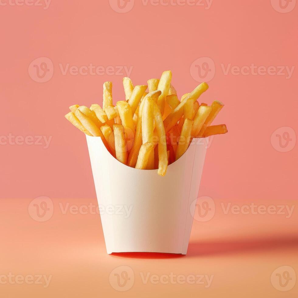 Crispy French Fries in a White Paper Container photo