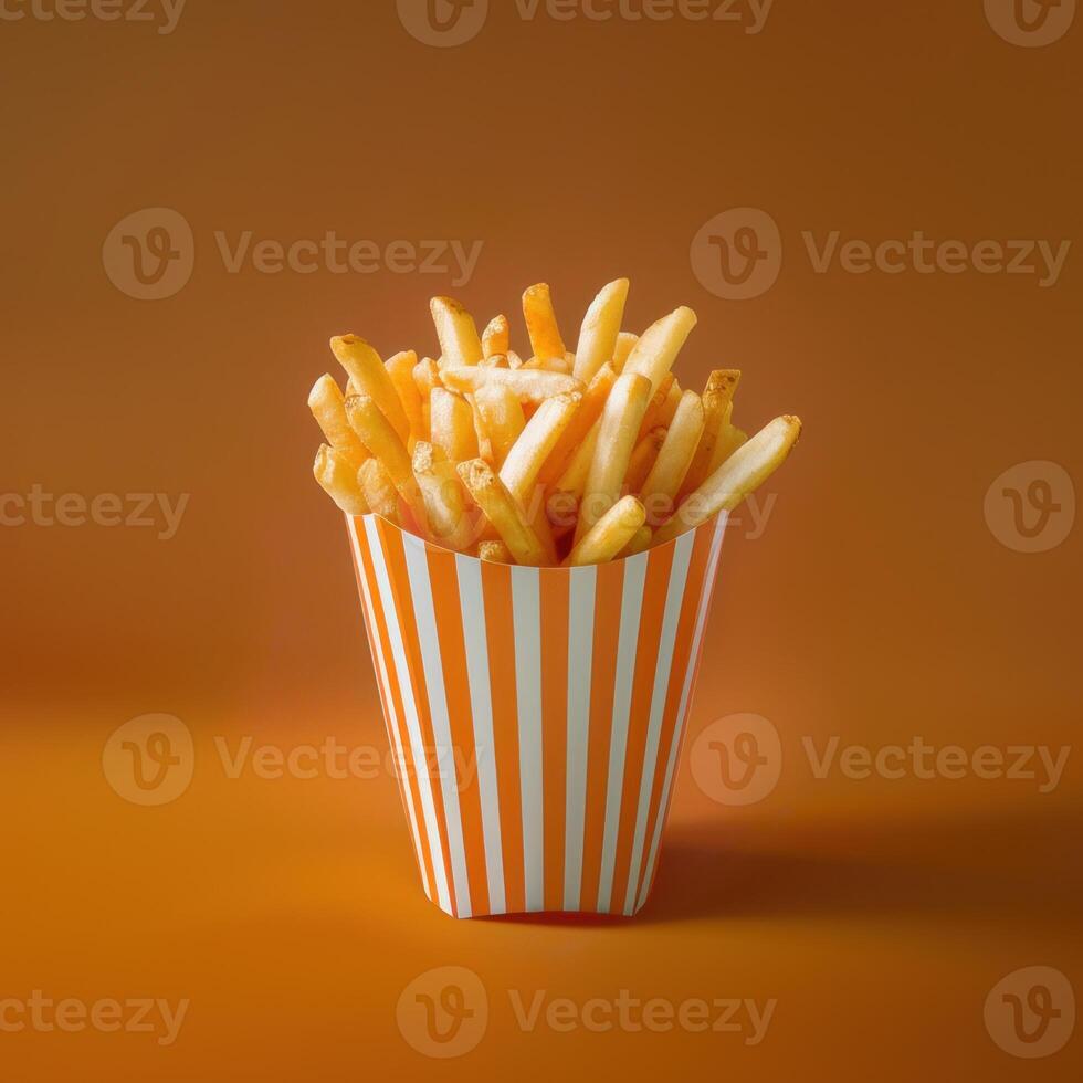 French Fries in a Striped Paper Container photo
