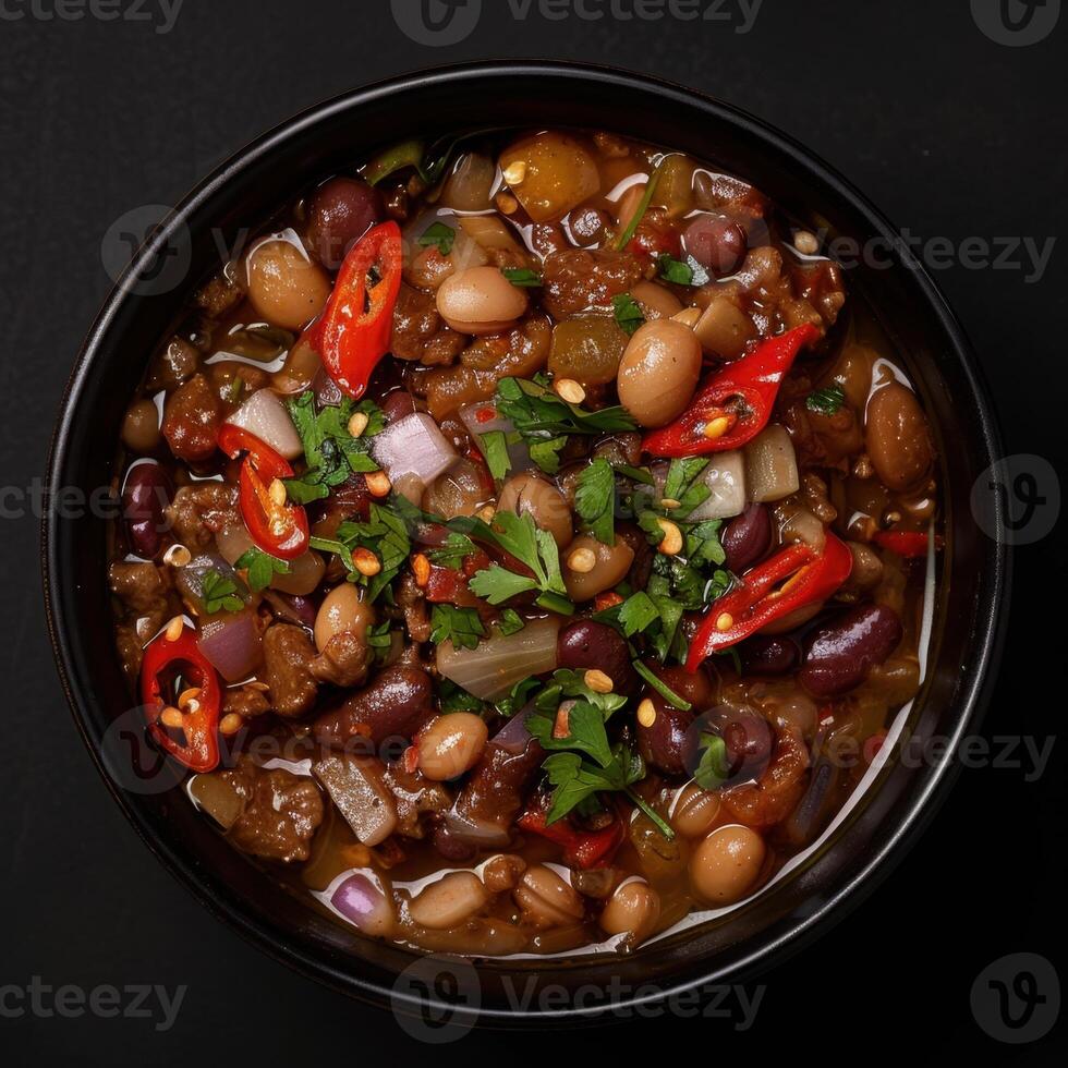 A Bowl of Hearty Chili with Red Chili Peppers photo