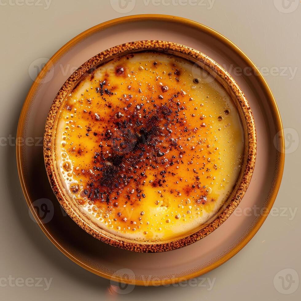 Close-up of a perfectly caramelized creme brulee with a crispy crust photo