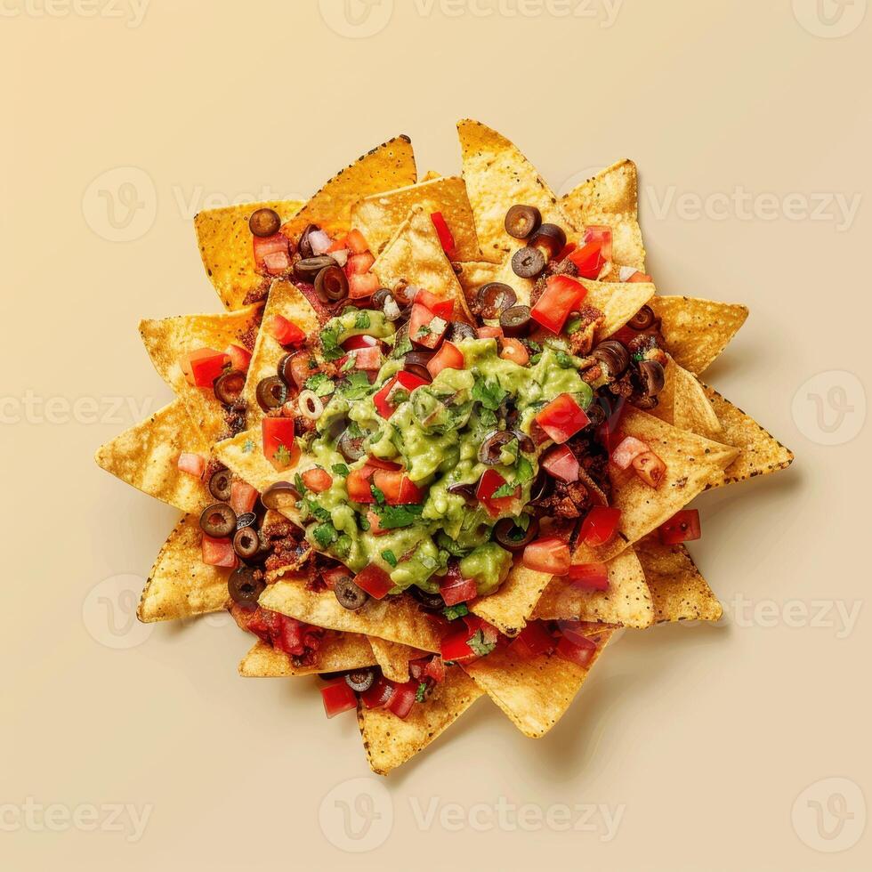 Close-up of delicious nachos with guacamole, tomatoes, and olives, perfect for a party or snack. photo