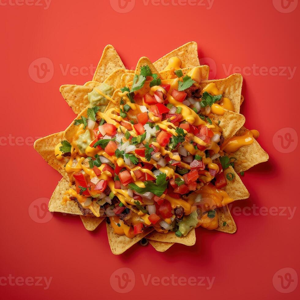 Close-up of a plate of nachos with cheese, salsa, guacamole, and cilantro. Concept of Mexican food, Tex-Mex, snack, appetizer, and party food. photo