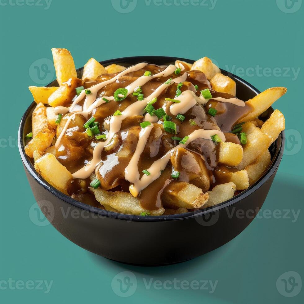 Closeup of poutine with gravy and cheese curds in a black bowl, popular Canadian dish with French fries. photo
