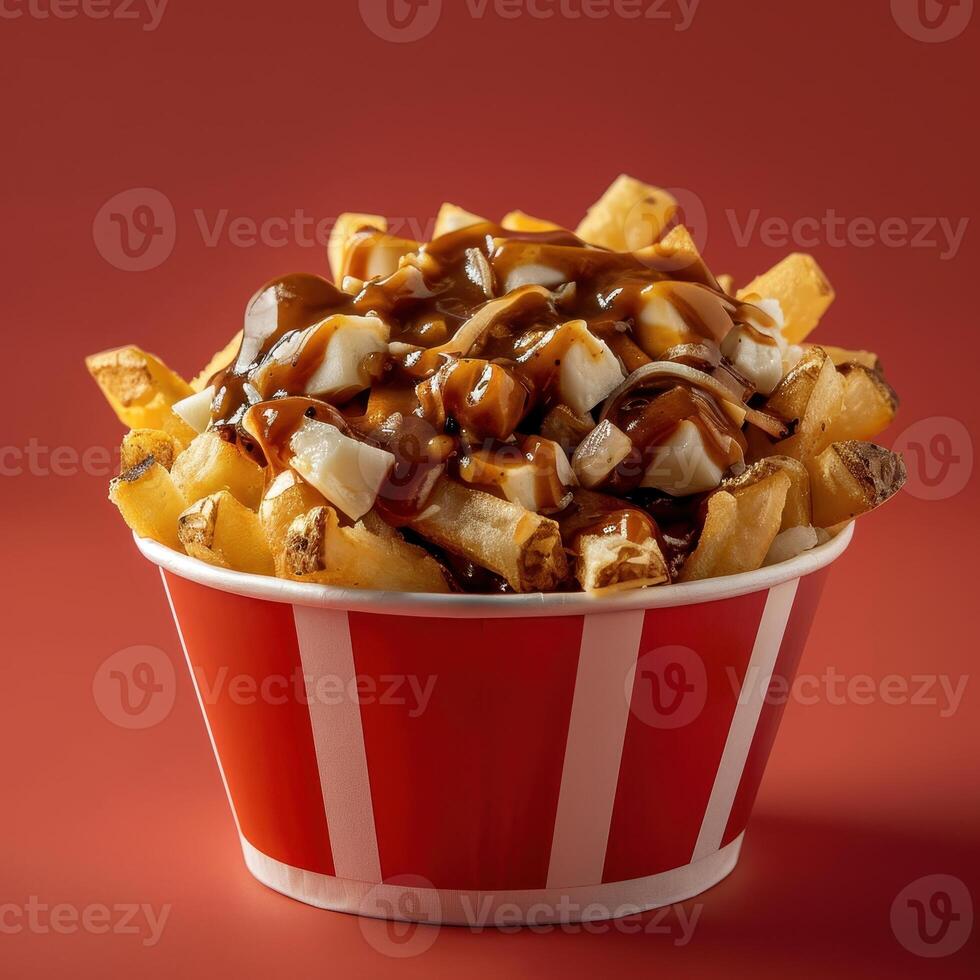 Poutine, Canadian Dish of French Fries, Cheese Curds and Gravy. photo