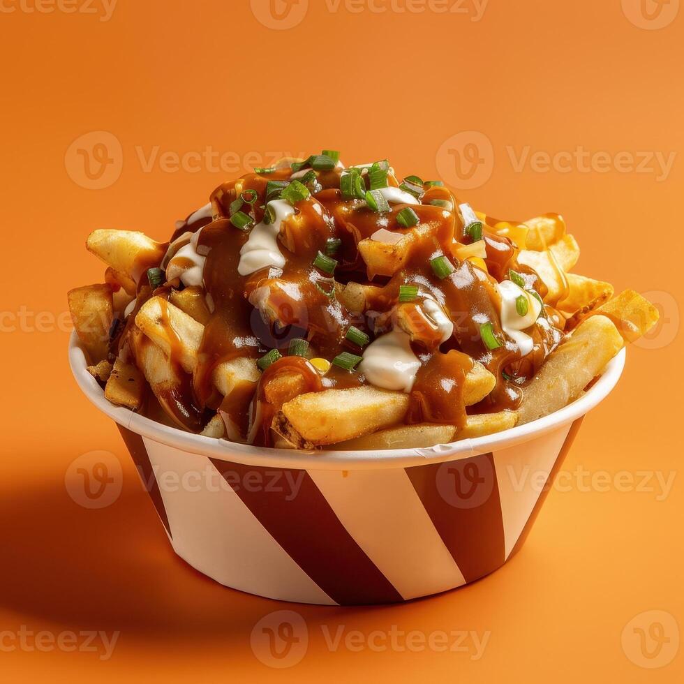 Delicious poutine with gravy, cheese curds and fries. Traditional Canadian dish. photo