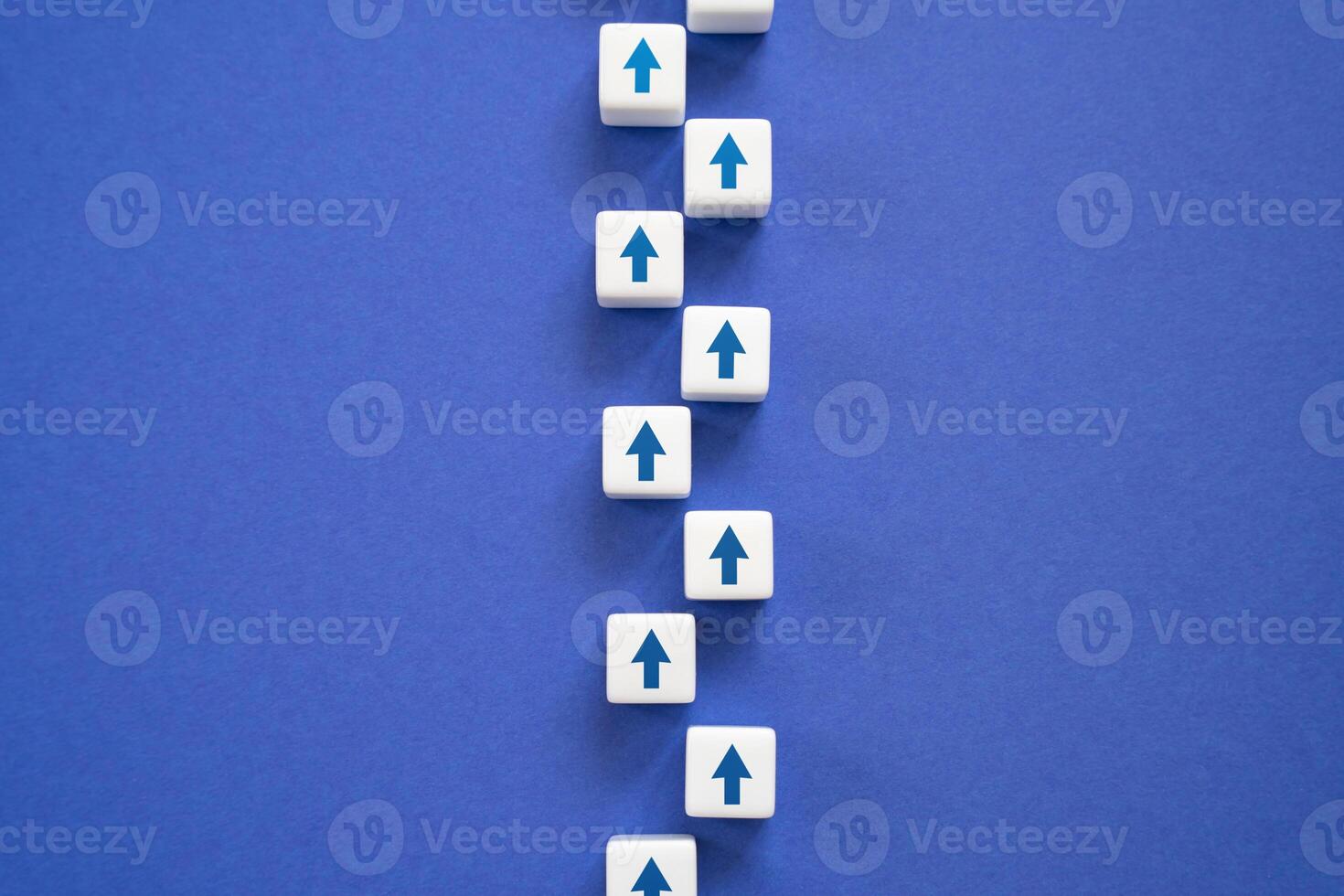 A path of arrows moving forward in a chain. Life path. The path is according to plan. photo