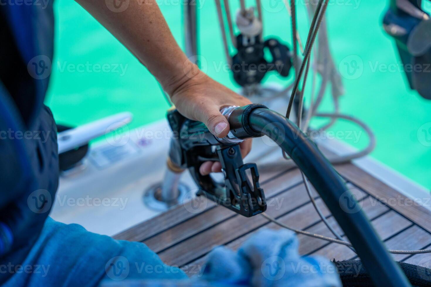 A man holds a petrole pistol and pours gasoline into a yacht on gas petrol station near sea for ship, boats and yachts in Rogoznica, Croatia. View from the yacht deck. High quality photo