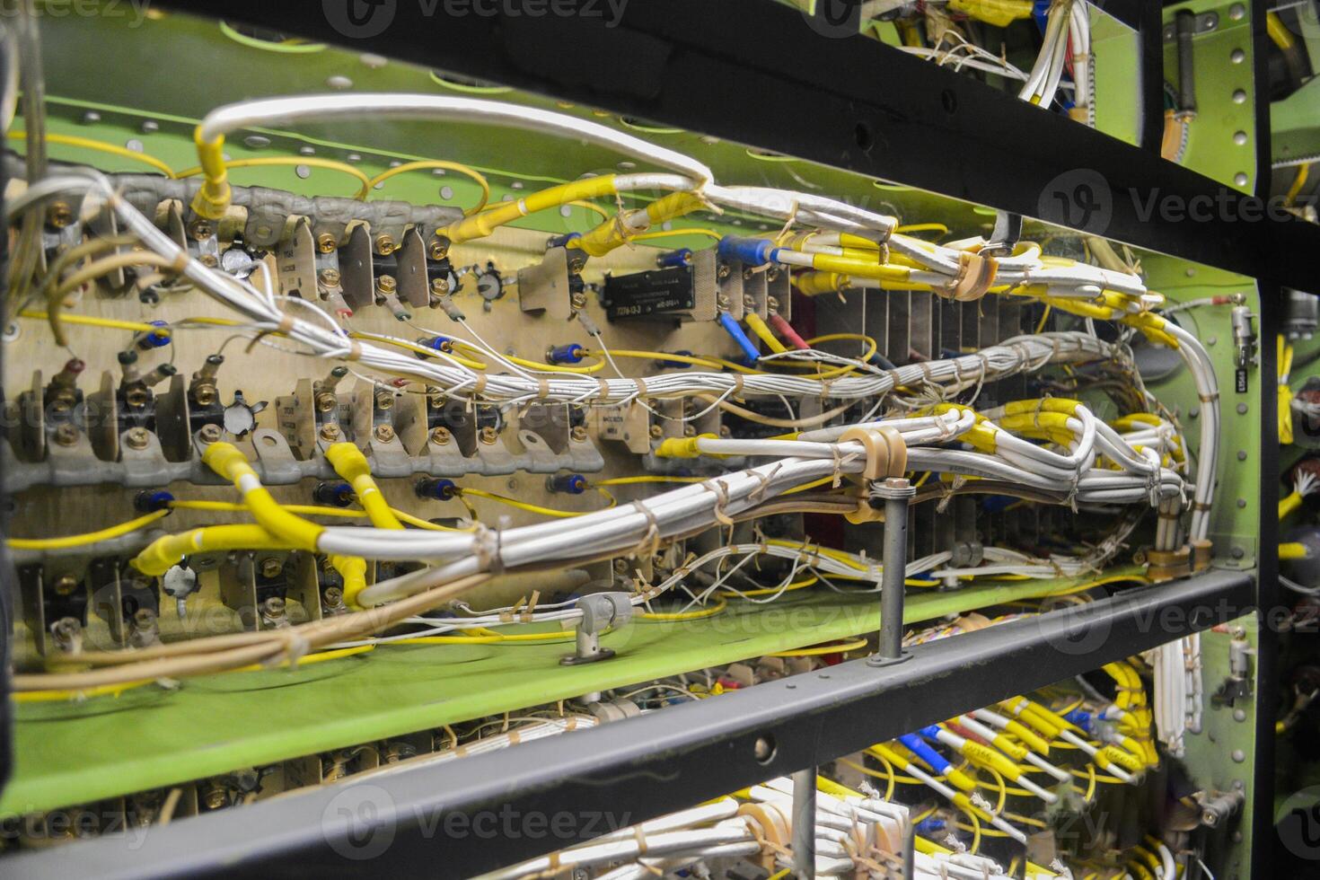 Colorful cables connected to server at data center. Colored cables intertwined with each other on the control system and server. photo