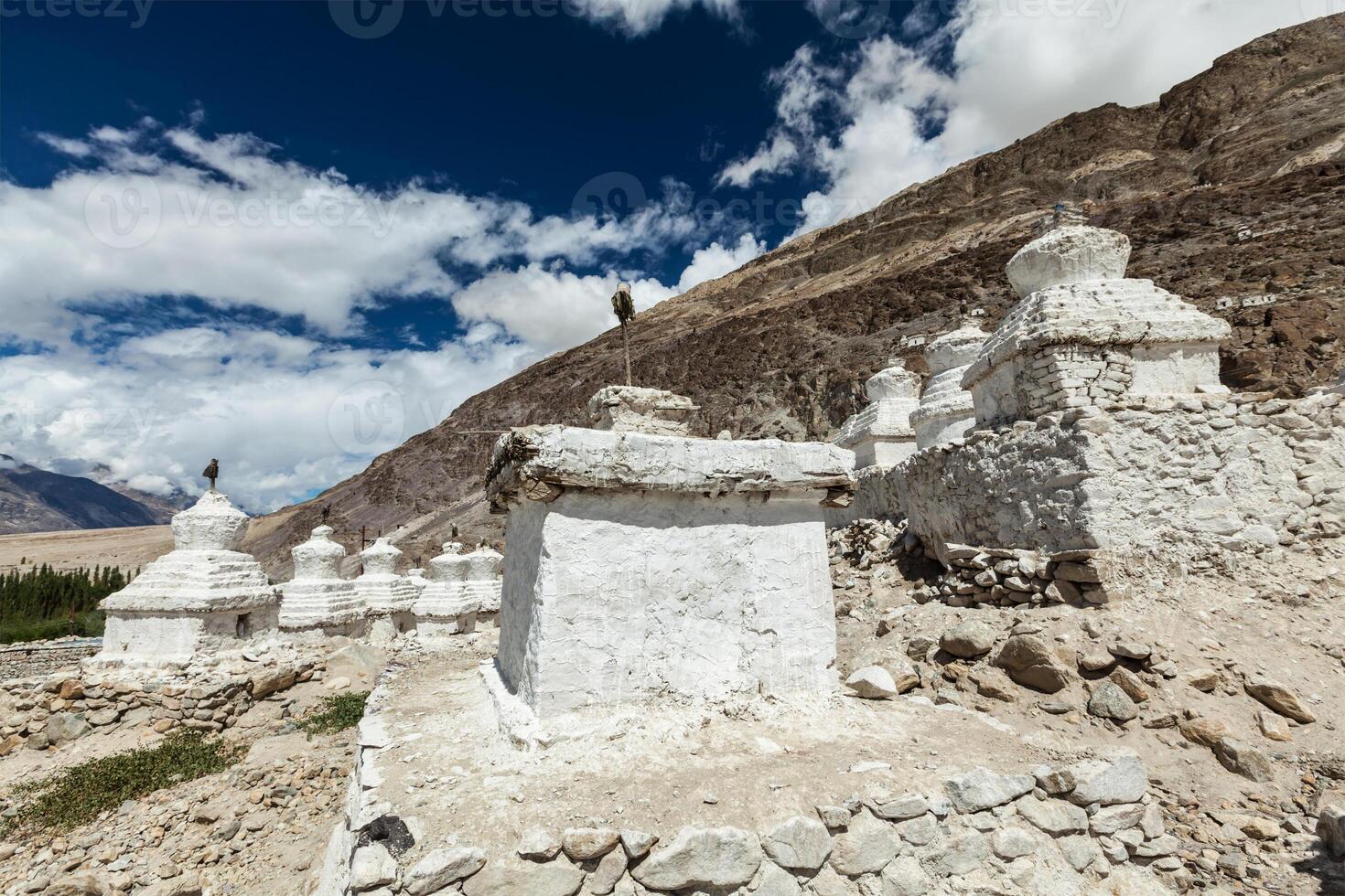 Chortens Tibetan Buddhism stupas in Himalayas photo