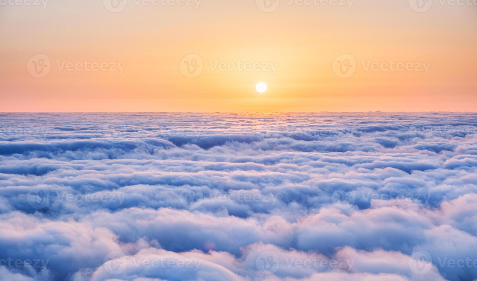 Aerial view of sunrise above clouds on Madeira island, Portugal photo