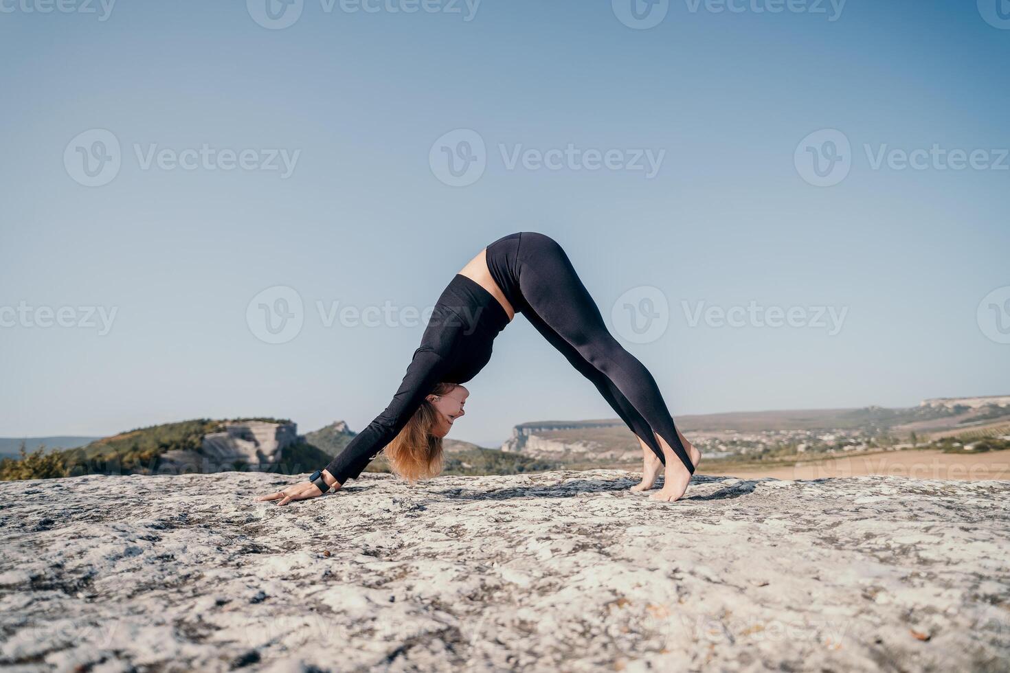 Yoga Practice on a Rocky Mountaintop photo
