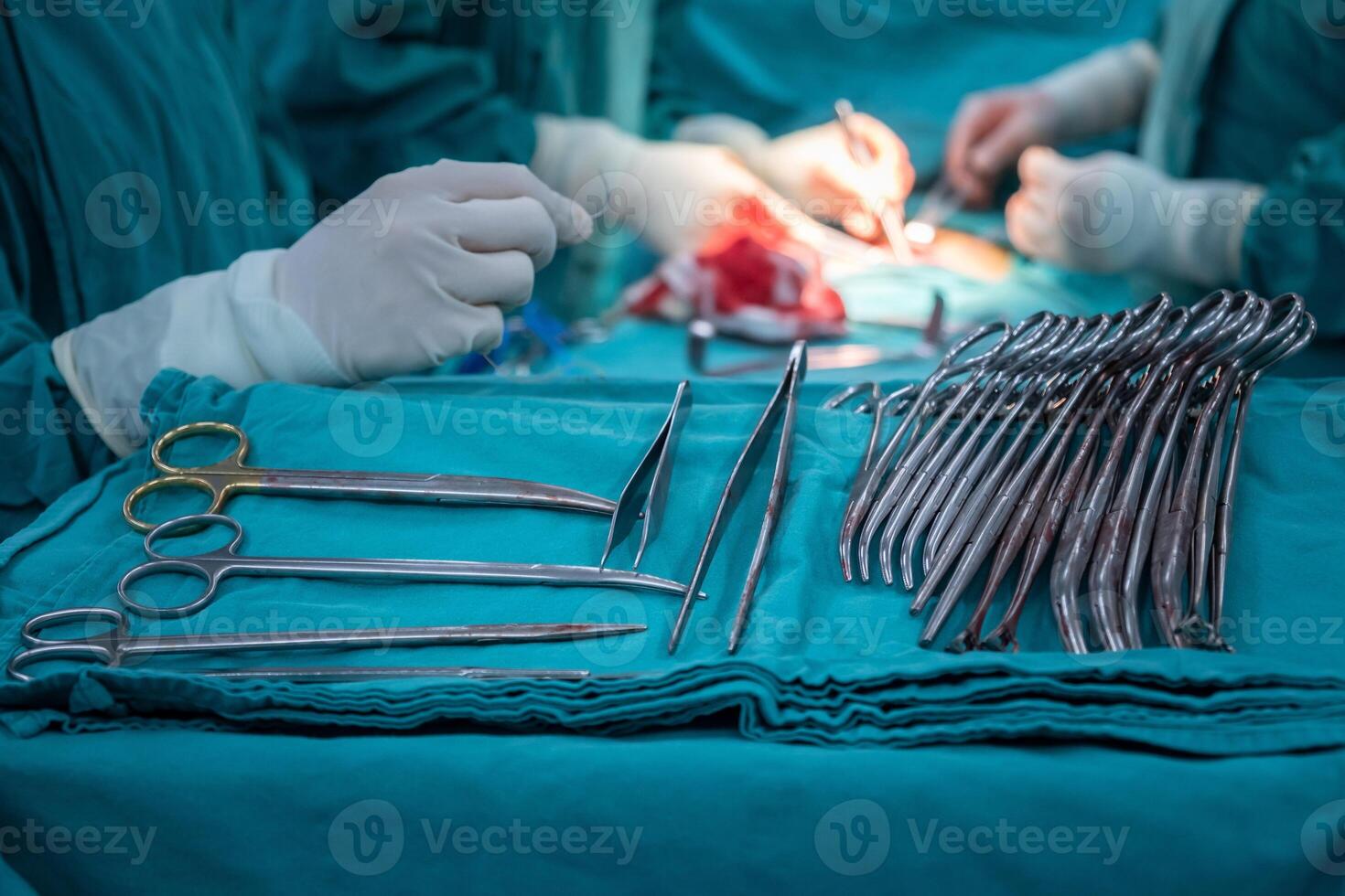 Group of Surgical Instruments used in surgical operation in operating room. An operating room may be designed and equipped to provide care to patients. photo