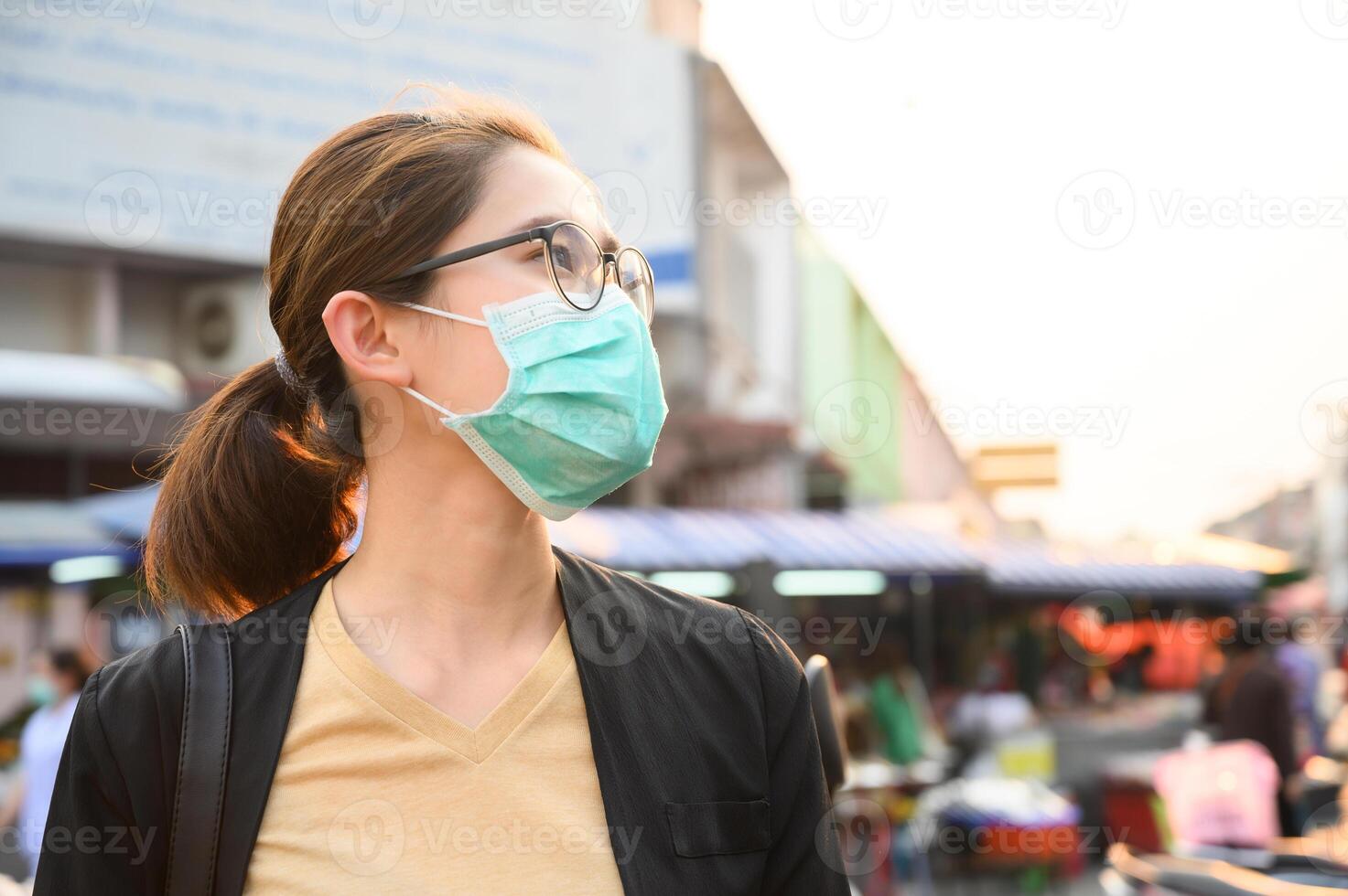 Woman wearing surgical mask for protect bad air pollution or virus in pandemic situations. photo
