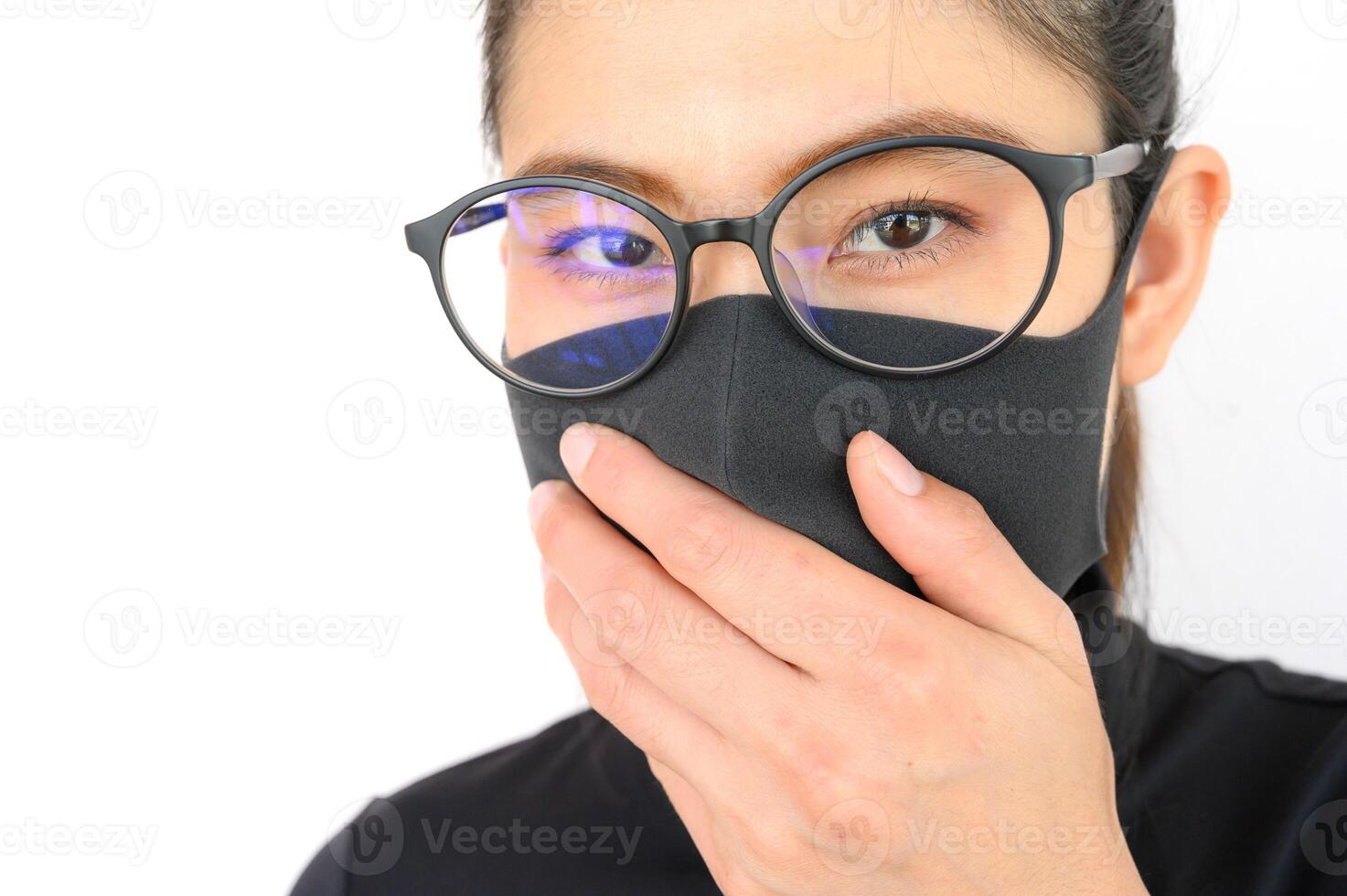 Close up of young Asian woman wearing black mask for protect smog PM2.5 bad air pollution. Air pollution has been associated with diseases of the heart and lungs, cancers and other health problems. photo
