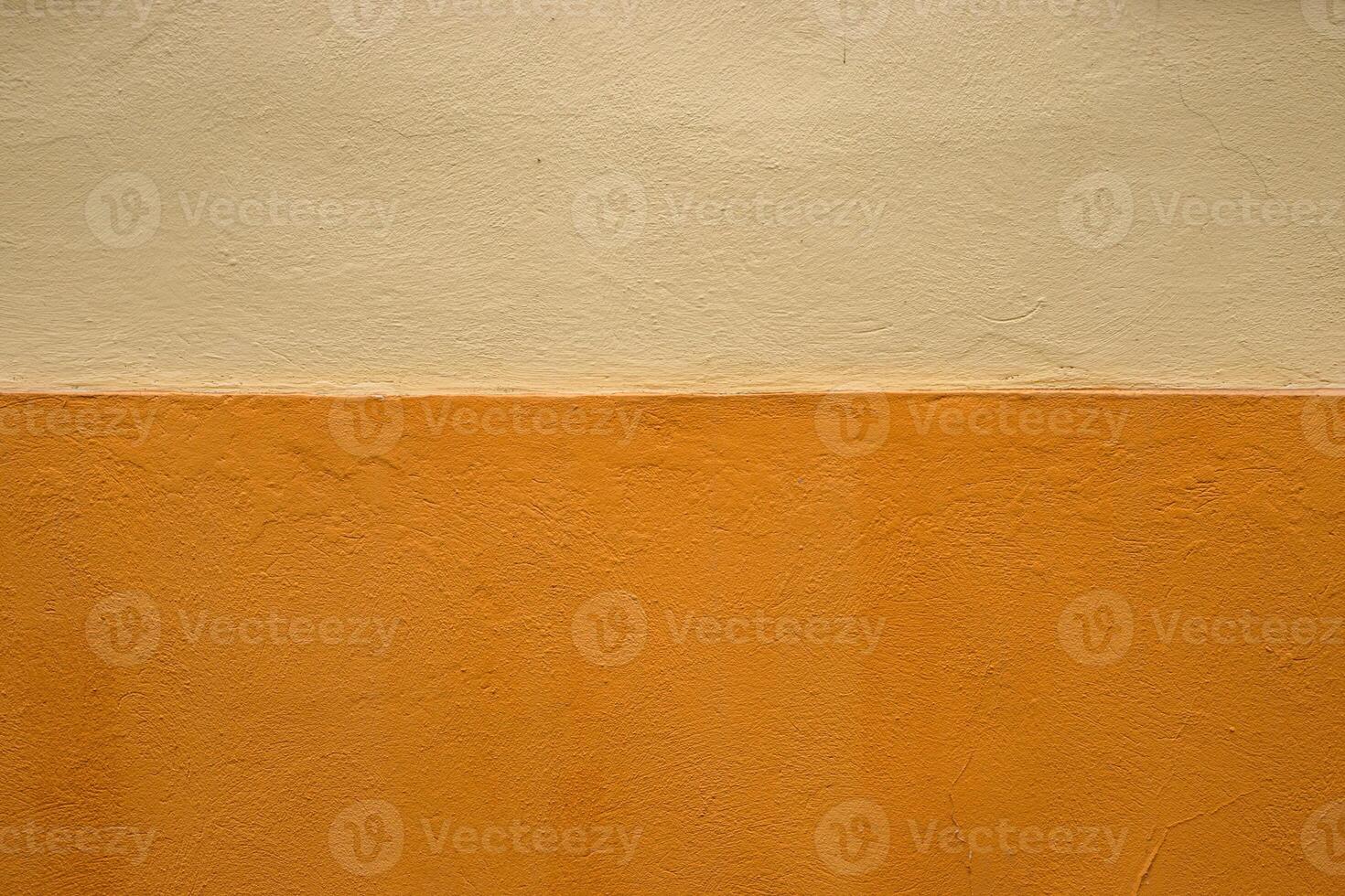 Vibrant orange wall texture with a subtle beige stripe, perfect for background, design inspiration or artistic project. Image of imperfections and unique details of an outdoor painted surface. photo