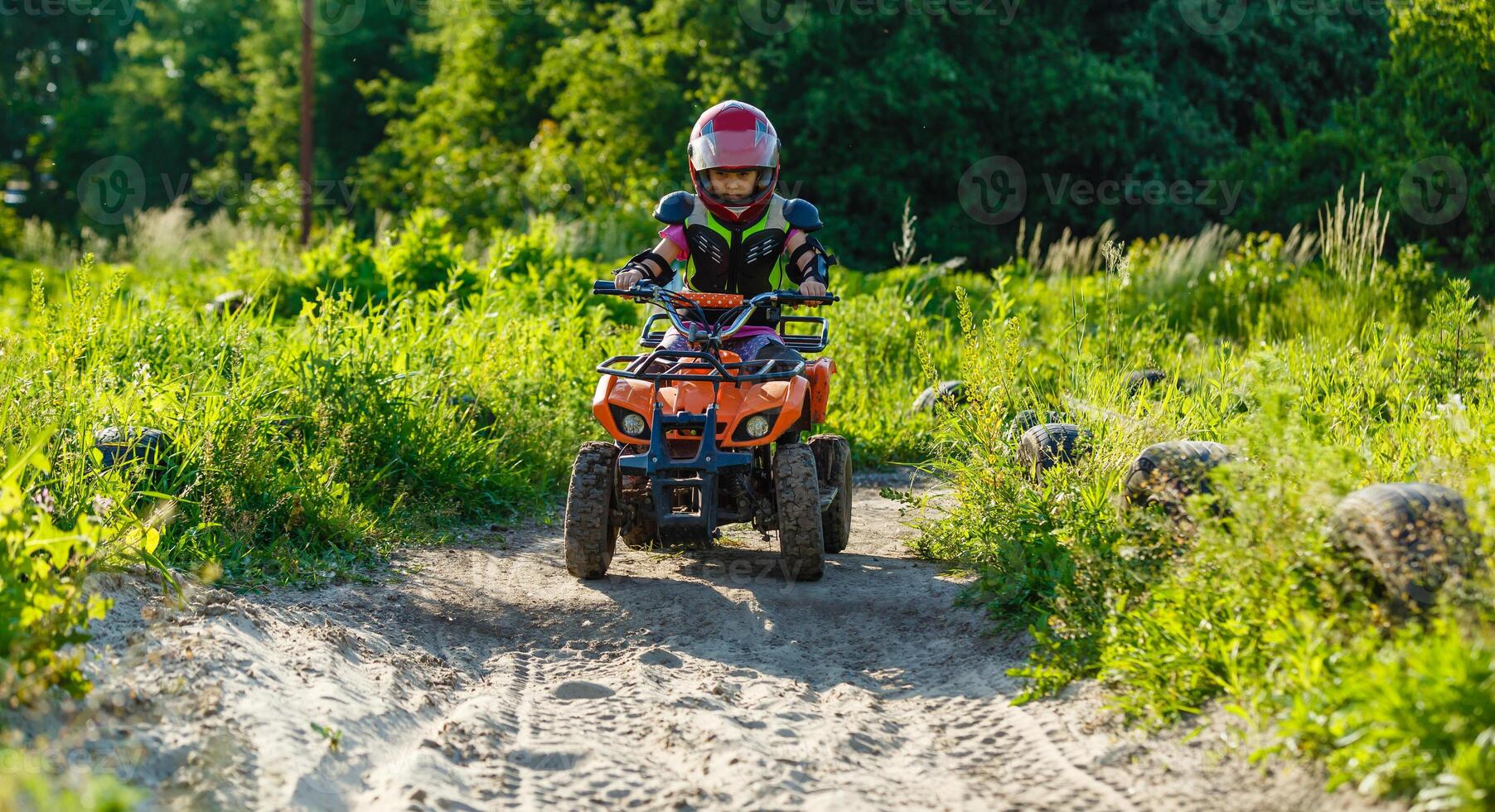 The little girl in protective clothing. Electric quad bike electric car for children popularizes green technology. 48798725 Stock Photo at Vecteezy