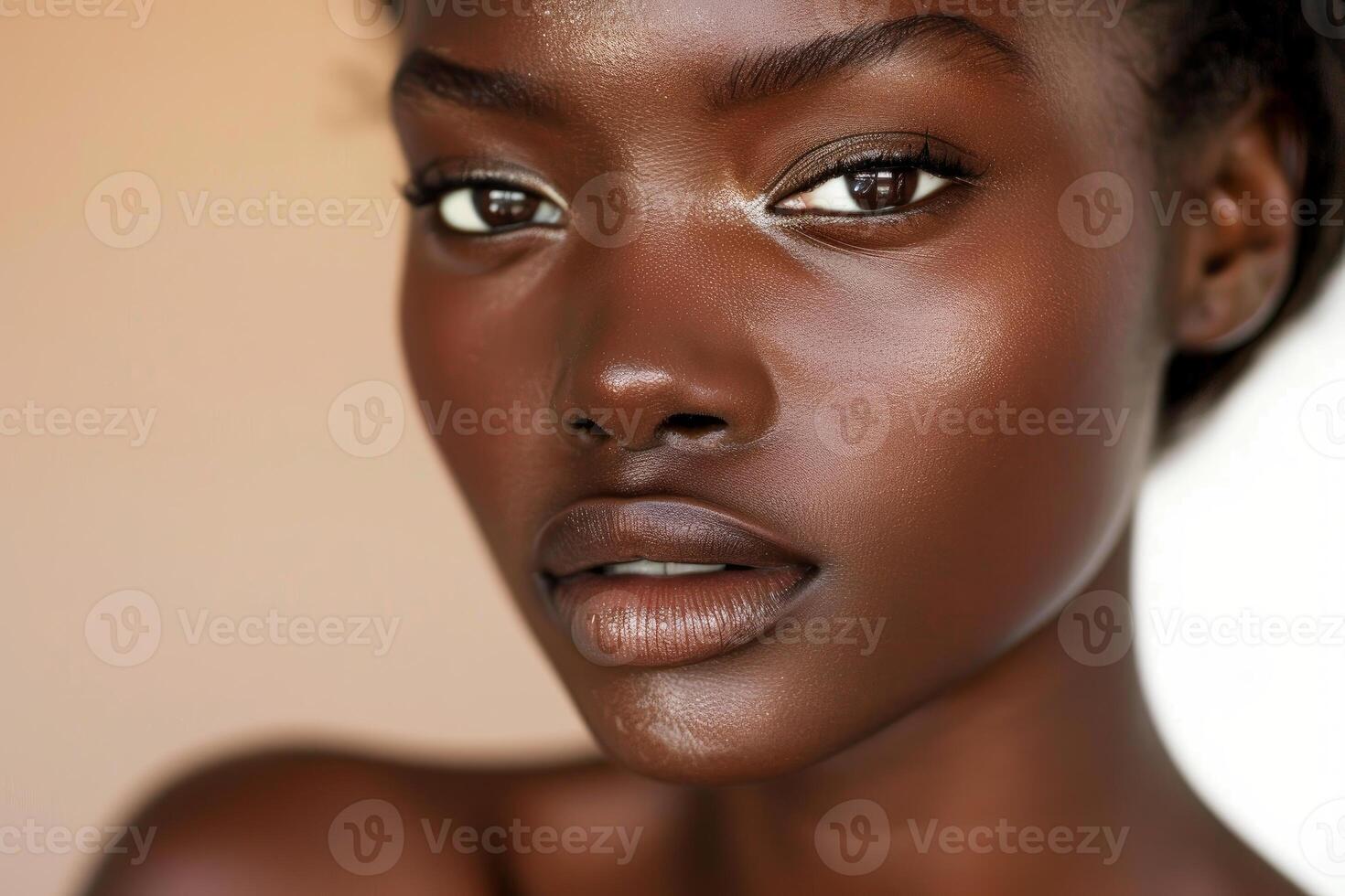 Young black woman showing her natural beauty posing in studio photo