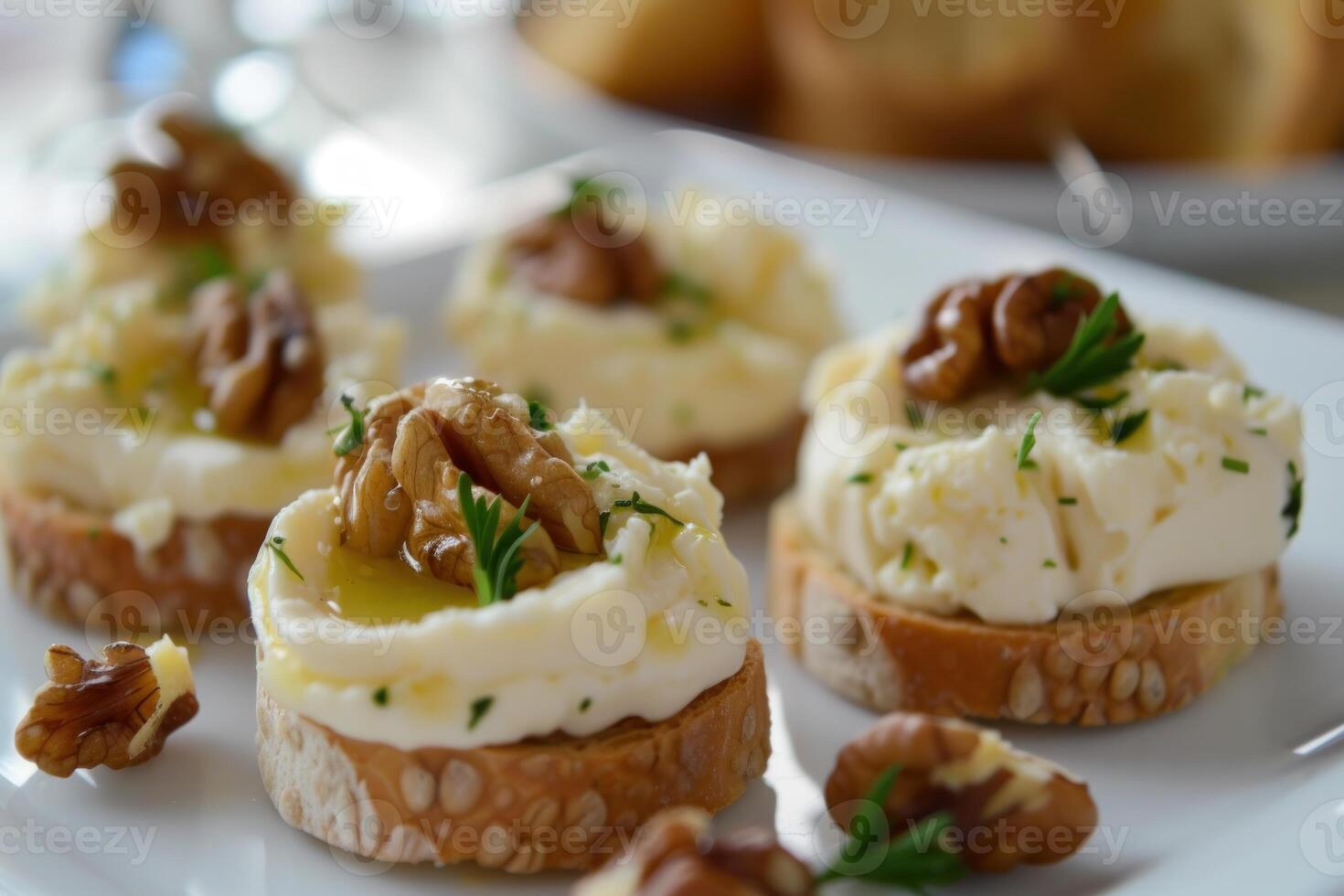 Gourmet cream cheese and walnut canapes on plate photo