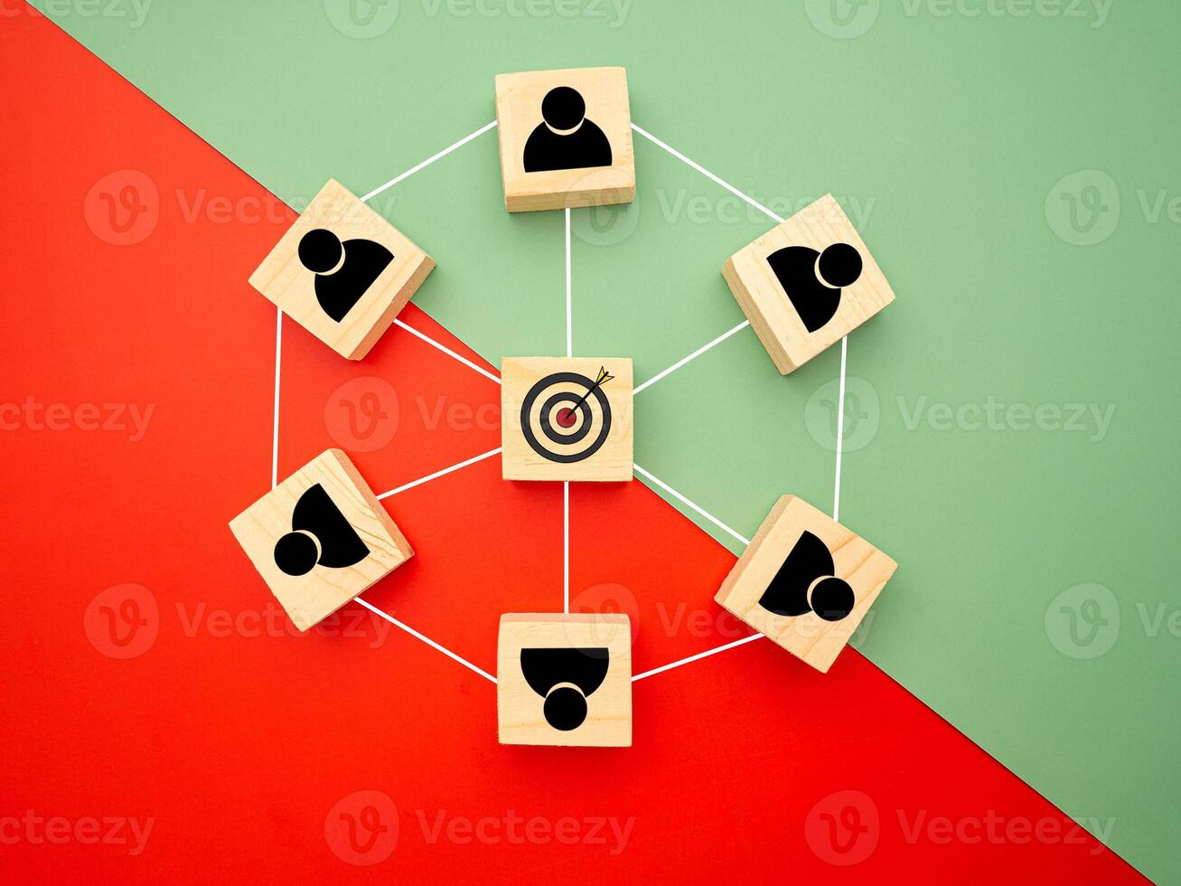 Focus on goal business. Network, teamwork, and unity concept. Top view of wooden blocks with human and goal icons on colorful background, Flat lay, space for text photo