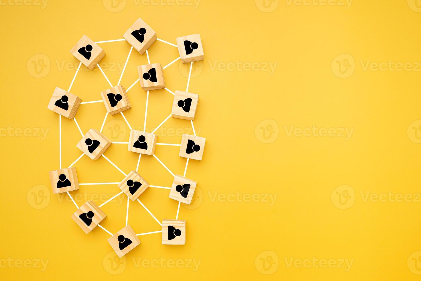 Network, Teamwork, and unity concept. Top view of wooden blocks with black human icons laid scattered on a yellow background, Flat lay, space for text photo
