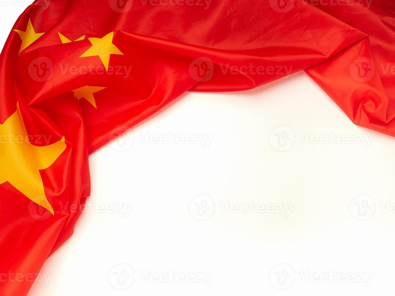 Part of the China flag is isolated on white background. Top view. Space for text photo