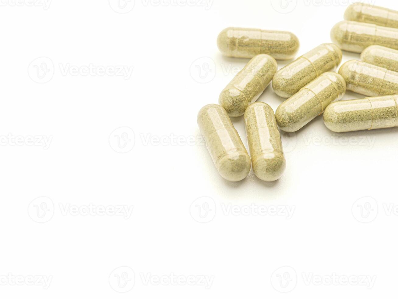 Flat lay of Andrographis Paniculata capsules isolated on white background. Space for text. Herbal, medicine, and healthcare concept photo