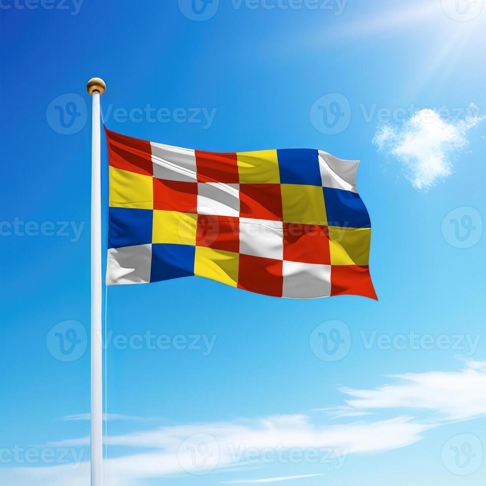 Waving flag of Antwerp is a province of Belgium on flagpole photo