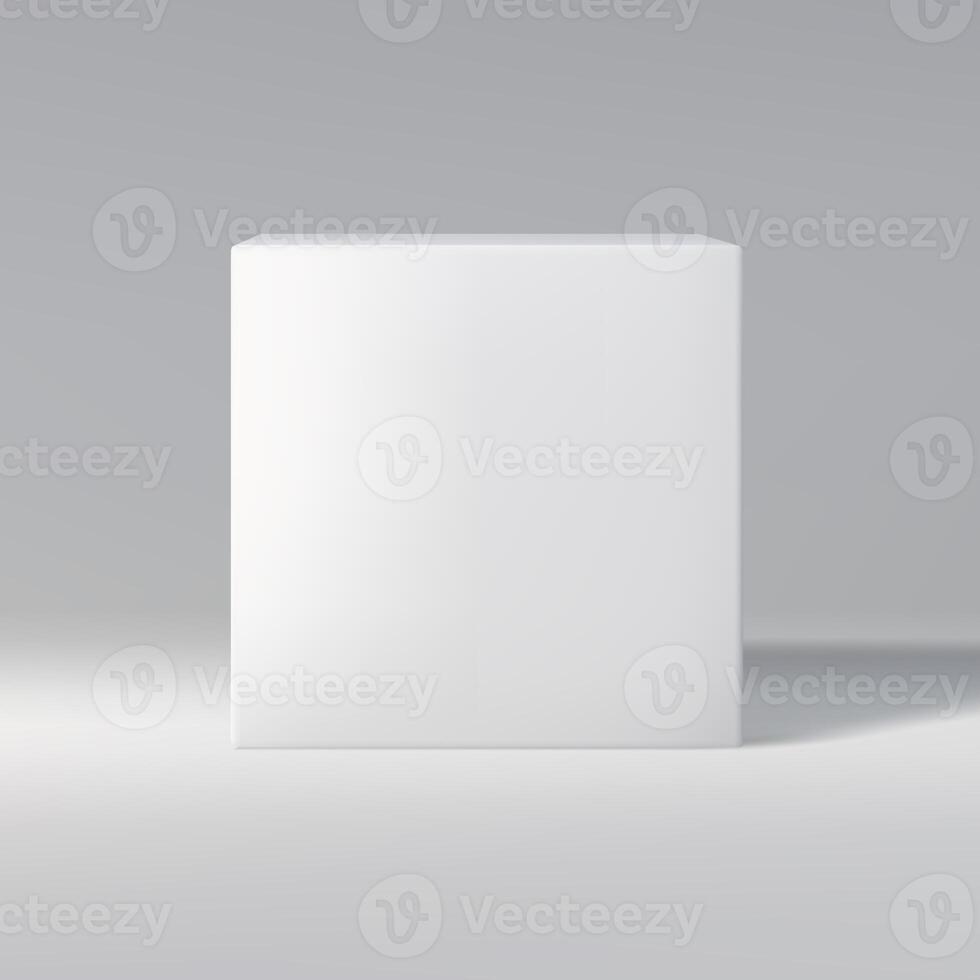 Simple white cube in front view on a gray gradient background, casting shadow. photo