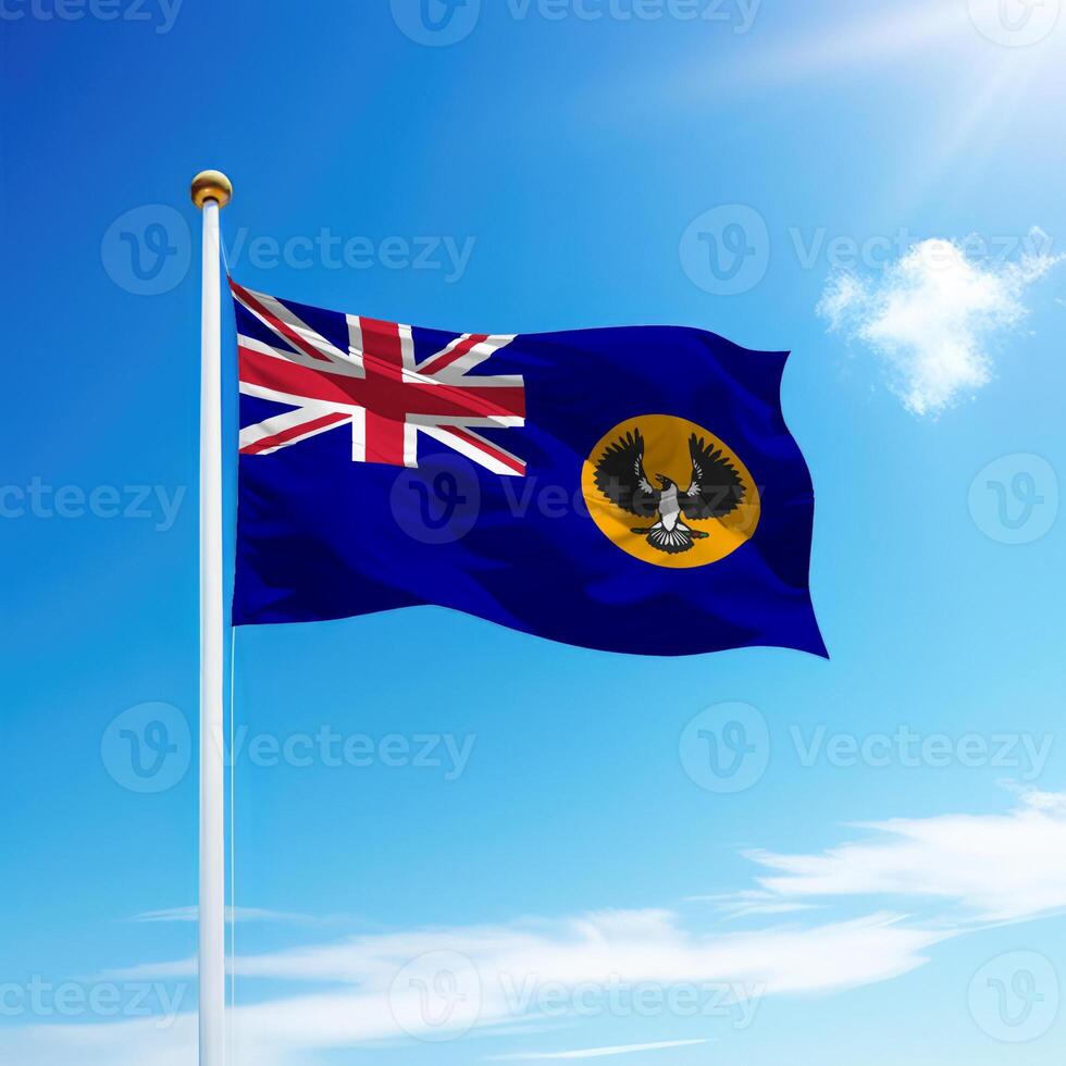 Waving flag of South Australia is a state of Australia on flagpole photo