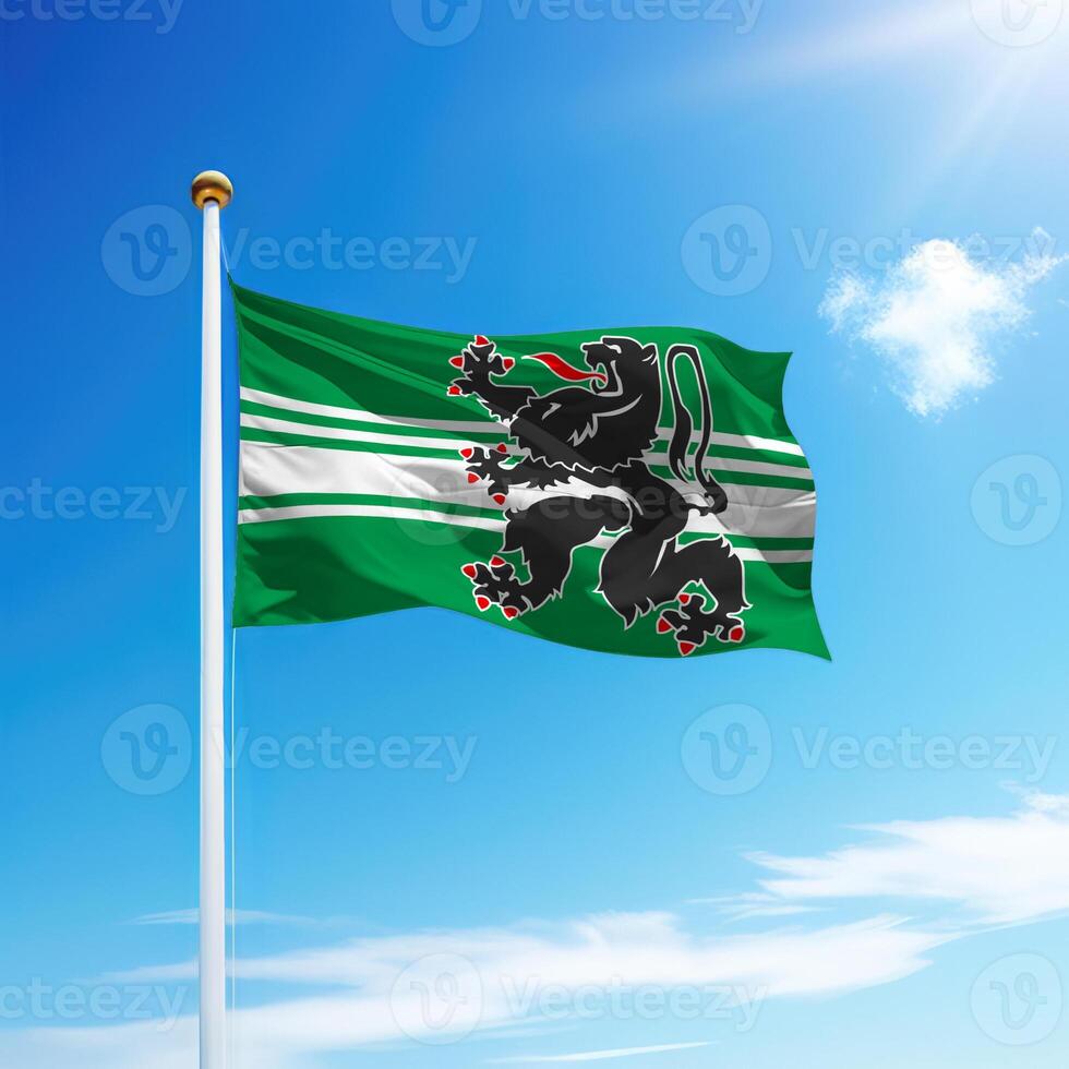 Waving flag of East Flanders is a province of Belgium on flagpole photo