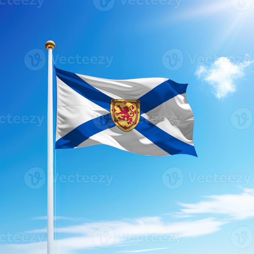 Waving flag of Nova Scotia is a province of Canada on flagpole photo