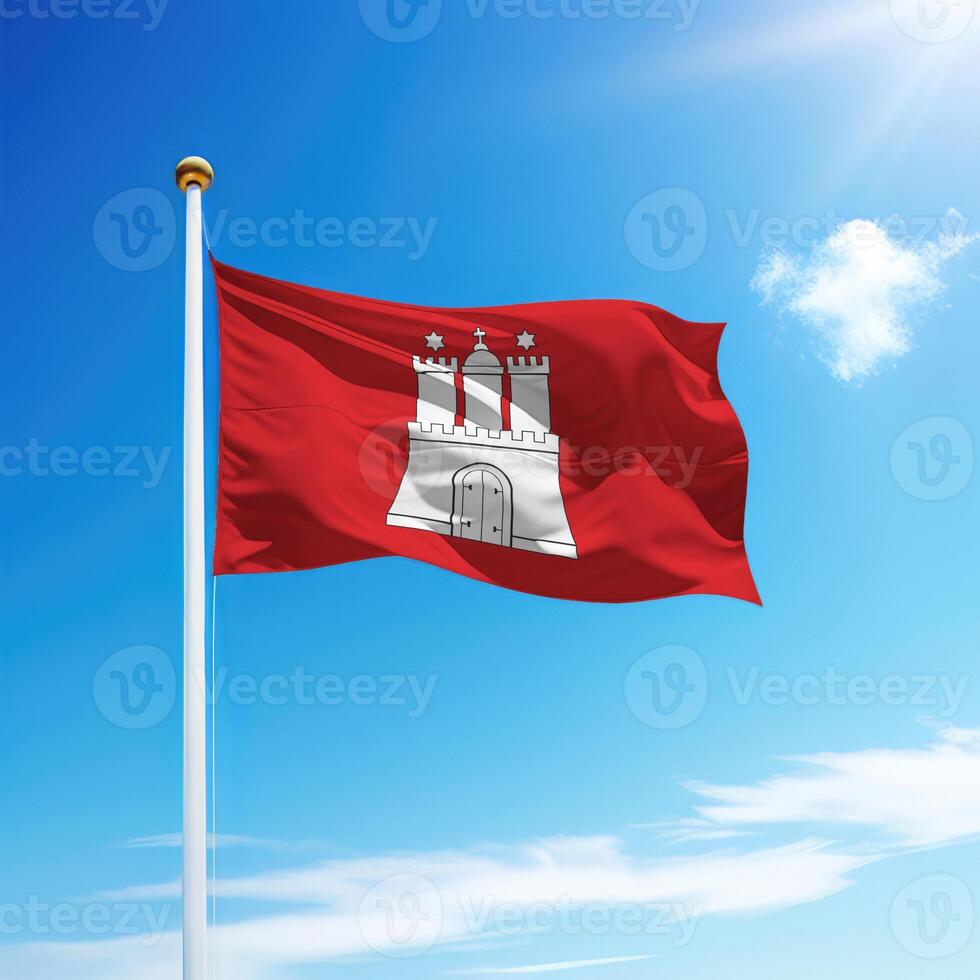 Waving flag of Hamburg is a state of Germany on flagpole photo
