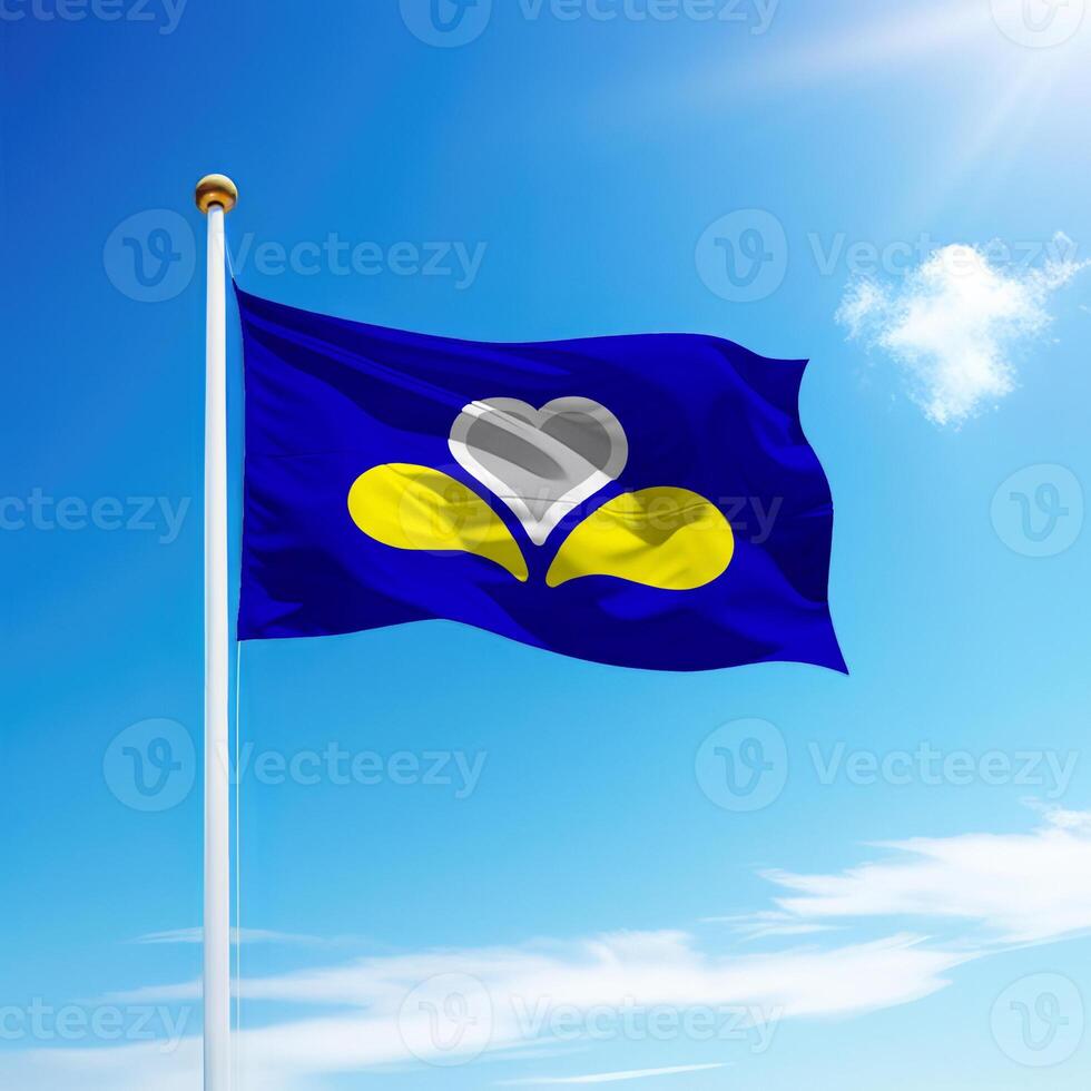 Waving flag of Brussels is a region of Belgium on flagpole photo