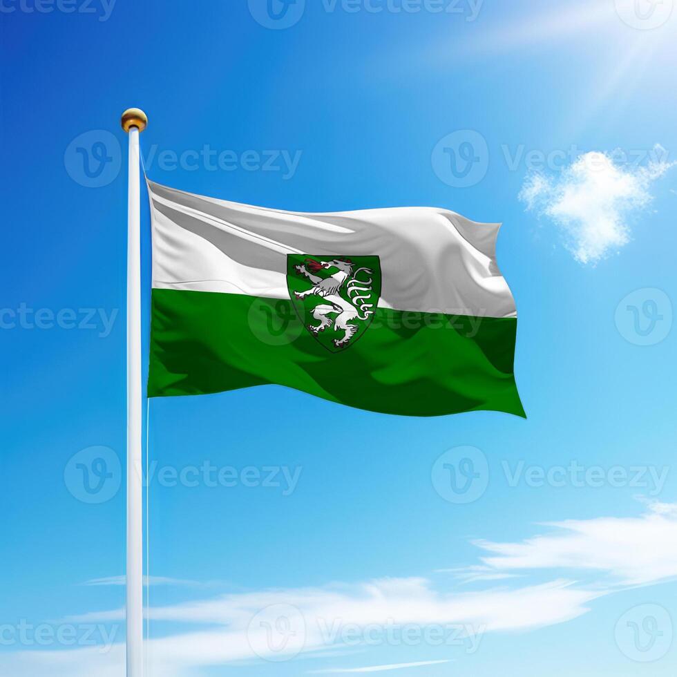 Waving flag of Styria is a state of Austria on flagpole photo