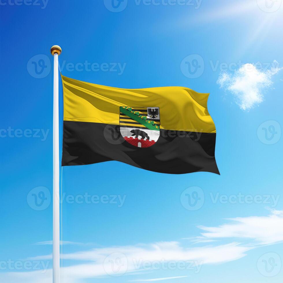 Waving flag of Saxony-Anhalt is a state of Germany on flagpole photo