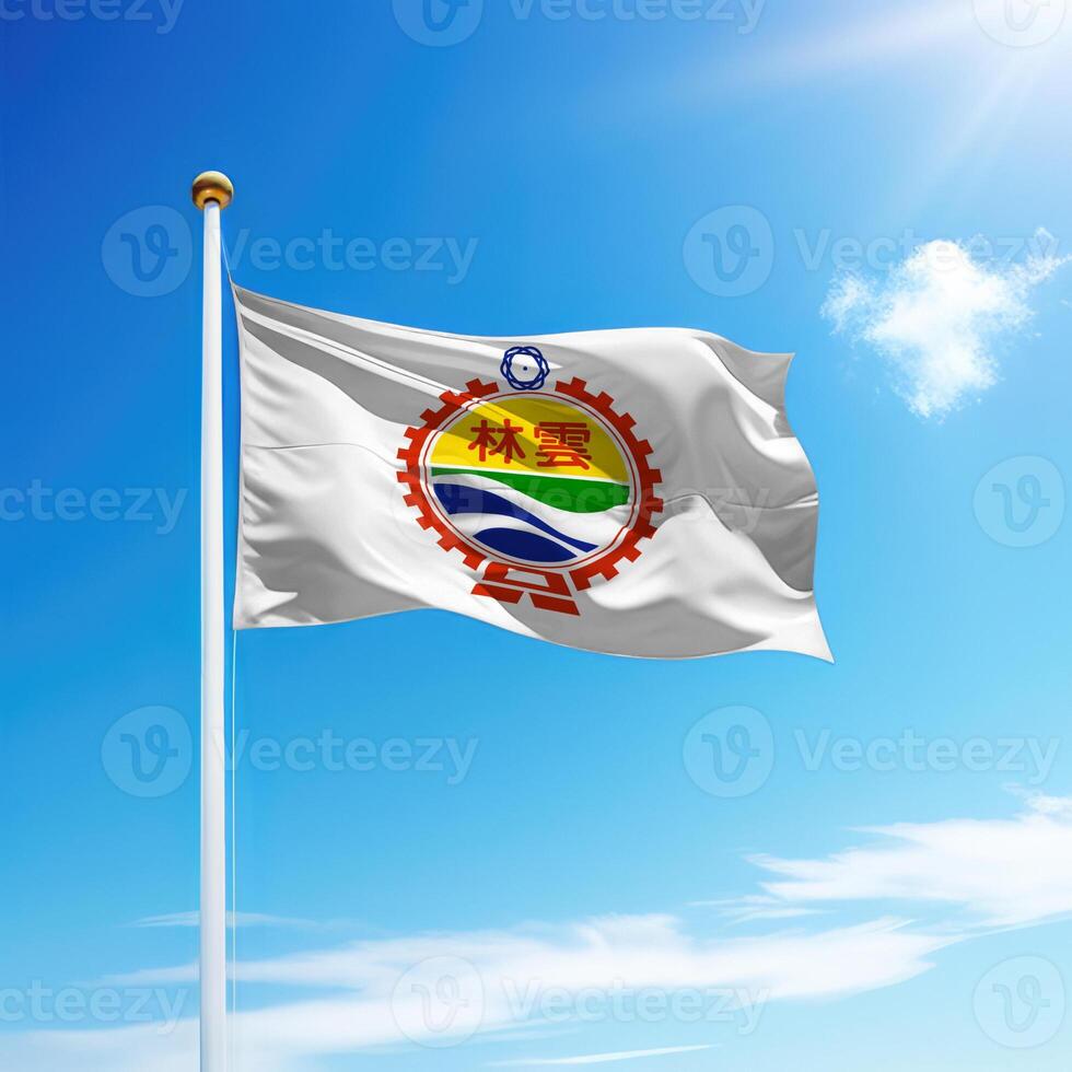 Waving flag of Yunlin County is a region of Taiwan on flagpole photo