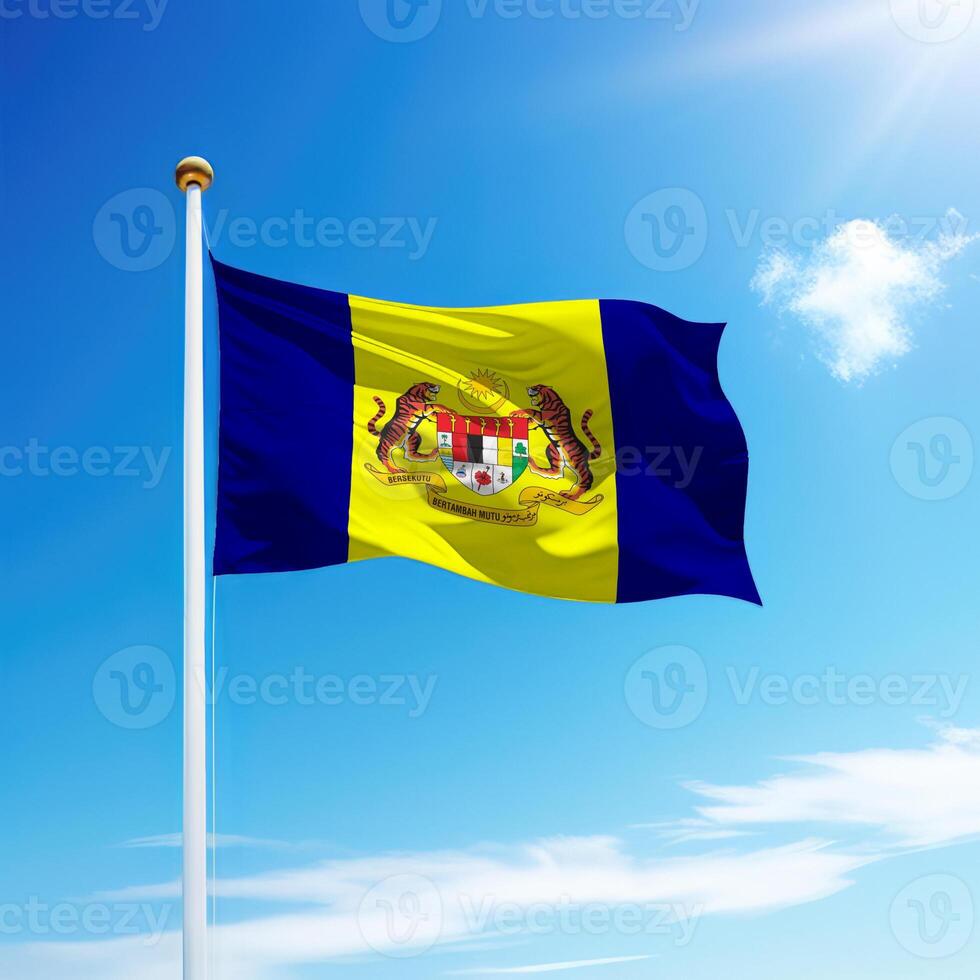 Waving flag of Putrajaya is a state of Malaysia on flagpole photo