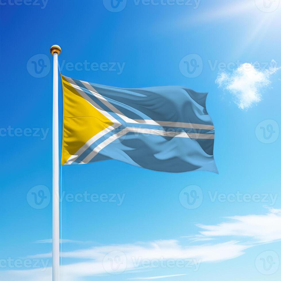 Waving flag of Tuva is a region of Russia on flagpole photo