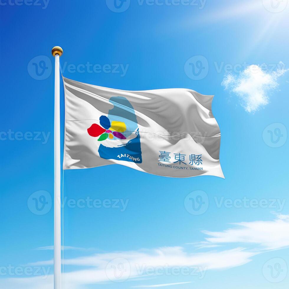 Waving flag of Taitung County is a region of Taiwan on flagpole photo