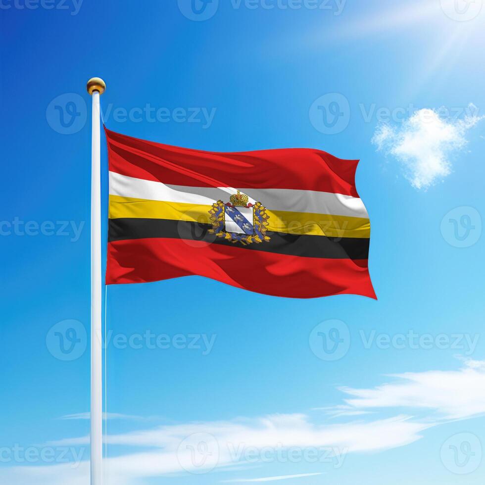 Waving flag of Kursk is a region of Russia on flagpole photo