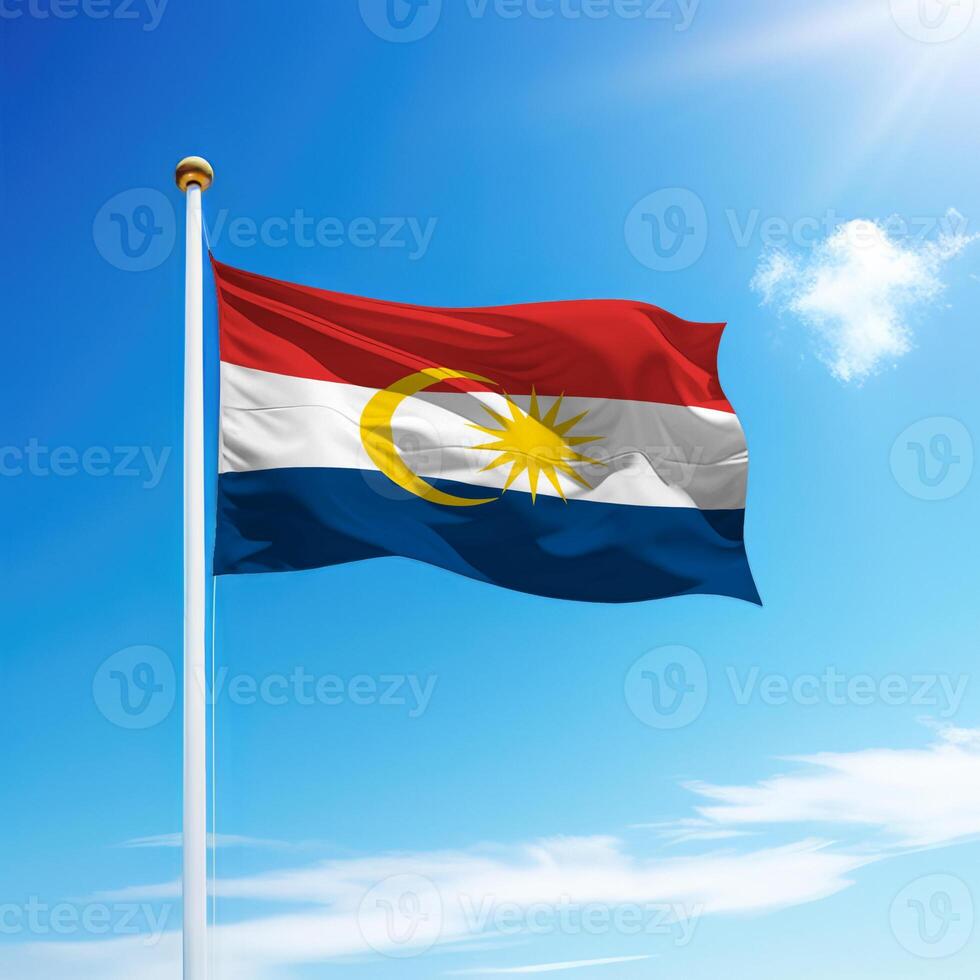 Waving flag of Labuan is a state of Malaysia on flagpole photo