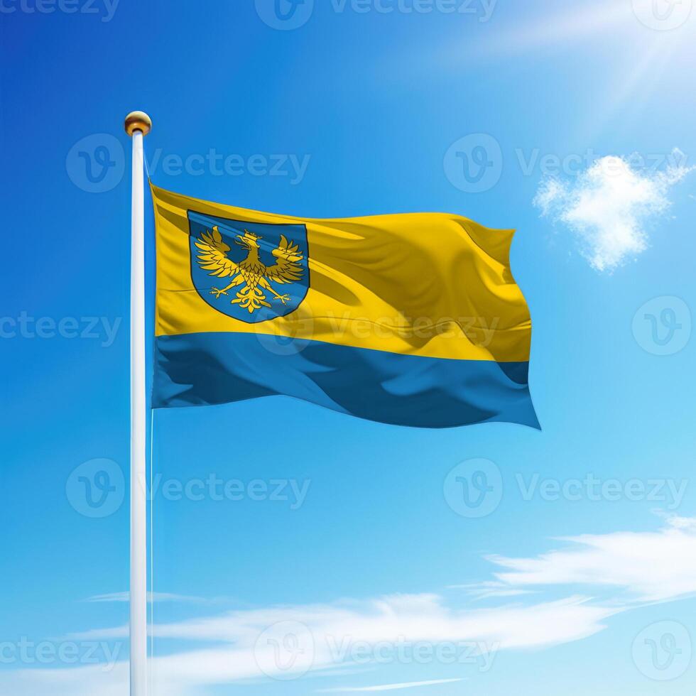 Waving flag of Opole is a region of Poland on flagpole photo