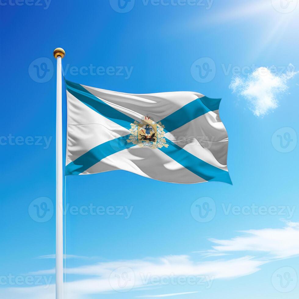 Waving flag of Arkhangelsk is a region of Russia on flagpole photo