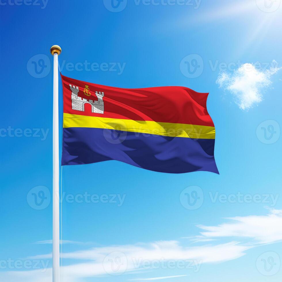 Waving flag of Kaliningrad is a region of Russia on flagpole photo