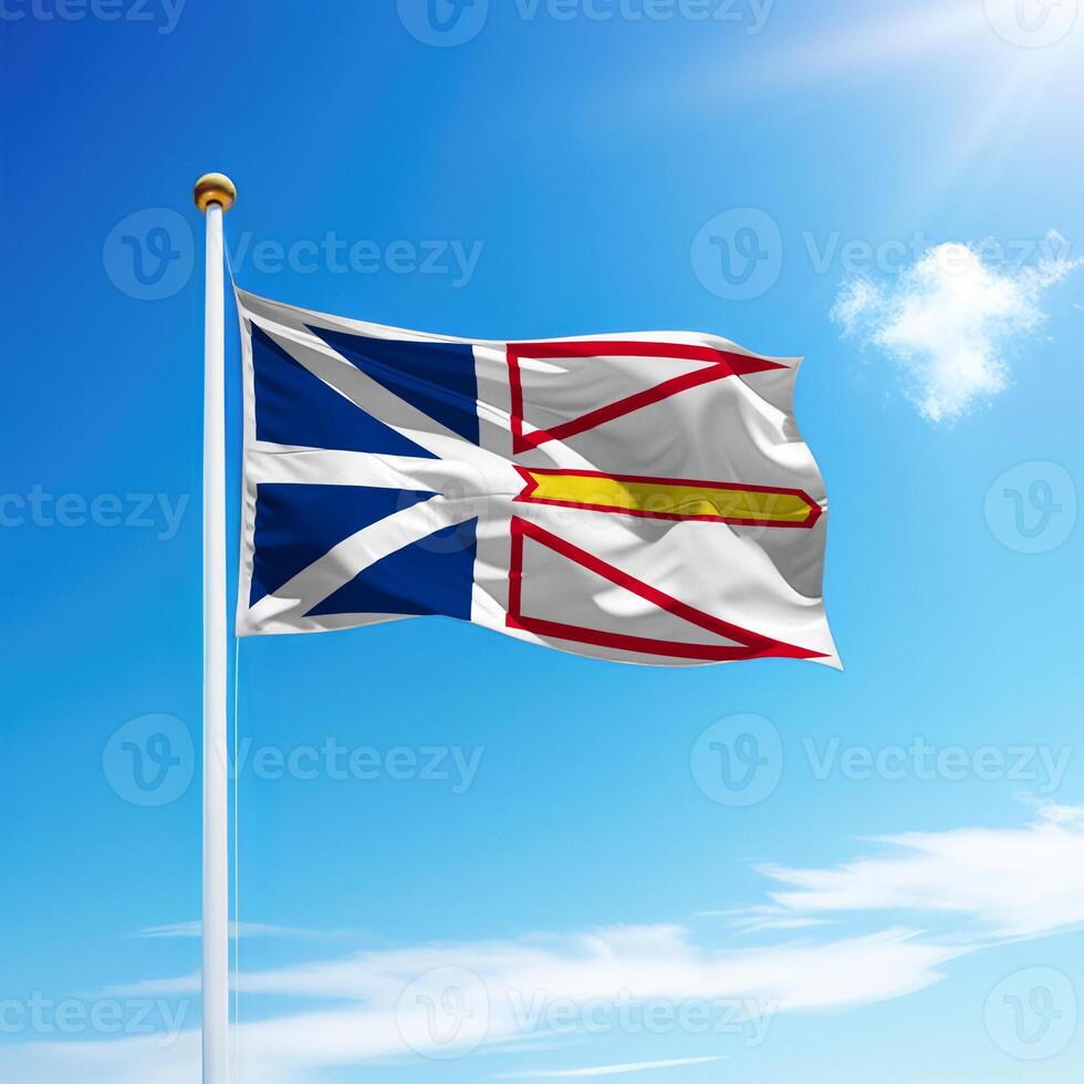 Waving flag of Newfoundland and Labrador is a province of Canada on flagpole photo